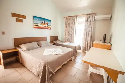 Uma cama ou camas num quarto em Pousada Lugar ao Sol