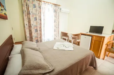 Uma cama ou camas num quarto em Pousada Lugar ao Sol