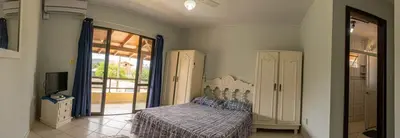 Uma cama ou camas num quarto em Casa 100m da praia, 10 pessoas, 3 quartos