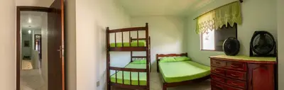 Uma cama ou camas num quarto em Casa 100m da praia, 10 pessoas, 3 quartos