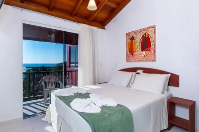Uma cama ou camas num quarto em Pousada Solar das Tartarugas