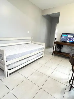 Uma cama ou camas num quarto em Residencial Melfi 3 - Apto 08 - Lateral