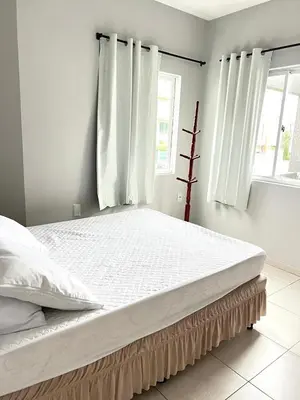 Uma cama ou camas num quarto em Residencial Melfi 3 - Apto 08 - Lateral