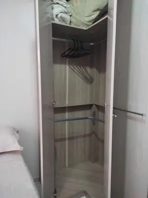 Uma cama ou camas num quarto em Um quarto em casa agradável