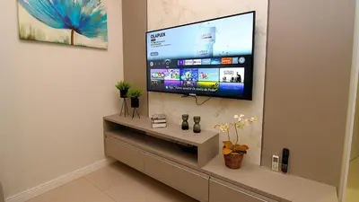 Uma televisão e/ou sistema de entretenimento em 1073 - Apartamento para locação no centro de Bombinhas