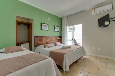 Uma cama ou camas num quarto em Pousada Vô Jaques