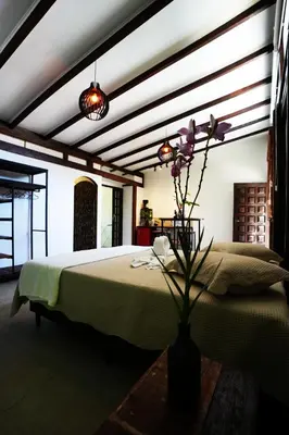 Uma cama ou camas num quarto em Pousada Aquarela de Bombinhas