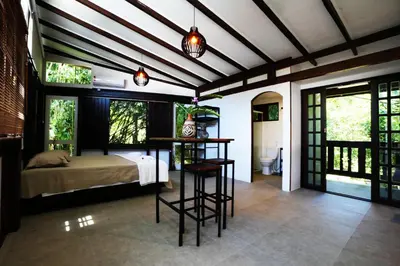 Uma cama ou camas num quarto em Pousada Aquarela de Bombinhas