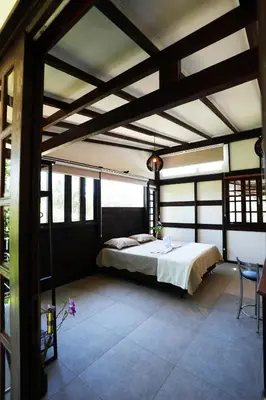 Uma cama ou camas num quarto em Pousada Aquarela de Bombinhas