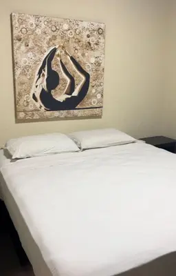 Uma cama ou camas num quarto em Pousada Aquarela de Bombinhas