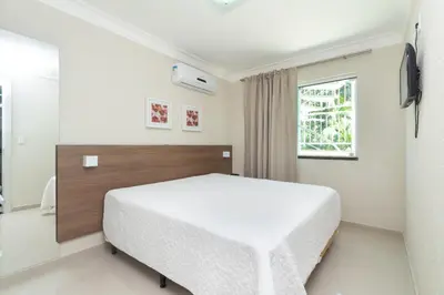 Uma cama ou camas num quarto em apto bombas bombinha summer beach apartamento 1 dormitorios privado
