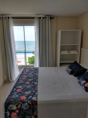 Uma cama ou camas num quarto em Pousada Bella Bombinhas - Pé na areia