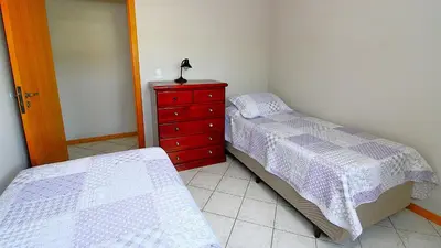 Uma cama ou camas num quarto em 1075 - Praia de Bombinhas locação de temporada