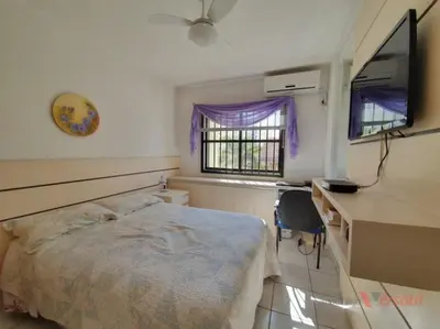 Uma televisão e/ou sistema de entretenimento em Apartamento Borges