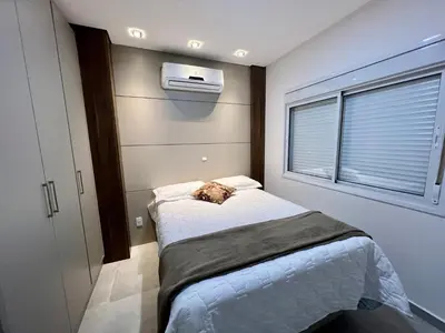 Uma cama ou camas num quarto em Para Momentos Beira Mar com Acesso Direto a Praia