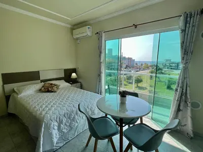Uma cama ou camas num quarto em Estúdio a 150 metros da Praia de Mariscal - V05