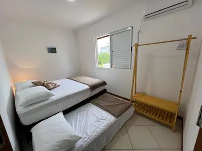 Uma cama ou camas num quarto em Combinação de Praia e Piscina - S1