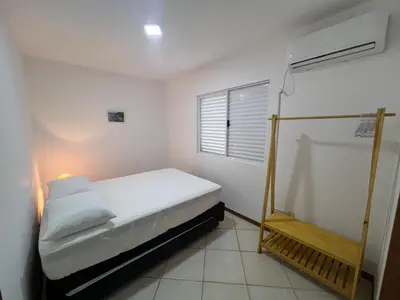Uma cama ou camas num quarto em Combinação de Praia e Piscina - S1