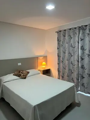 Uma cama ou camas num quarto em Hospedaria Sal De Mariscal 08