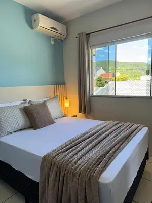 Uma cama ou camas num quarto em Residencial Golfinho - Palmas, Apto 02