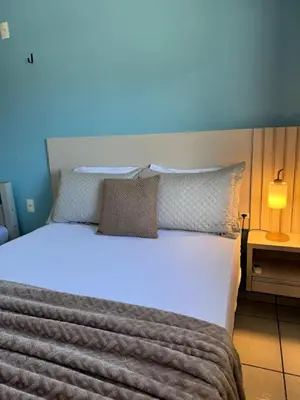 Uma cama ou camas num quarto em Residencial Golfinho - Palmas, Apto 02