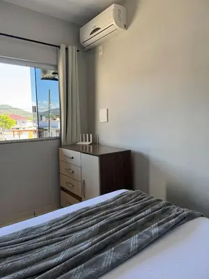 Uma cama ou camas num quarto em Residencial Golfinho - Palmas, Apto 02