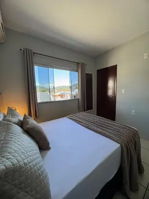 Uma cama ou camas num quarto em Residencial Golfinho - Palmas, Apto 02