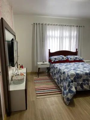 Uma cama ou camas num quarto em Casa Bombinhas