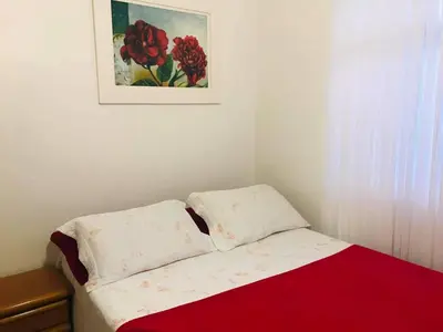 Uma cama ou camas num quarto em Casa Bombinhas
