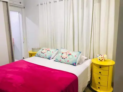 Uma cama ou camas num quarto em Casa Bombinhas