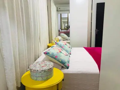 Uma cama ou camas num quarto em Casa Bombinhas