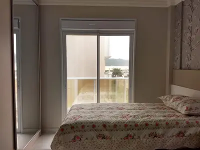 Uma cama ou camas num quarto em Lumini 103