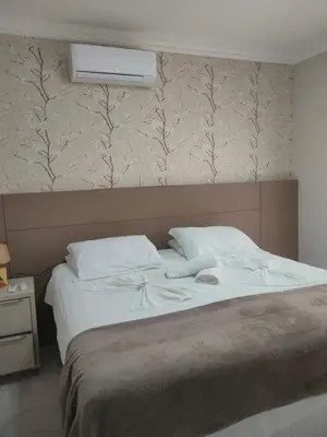 Uma cama ou camas num quarto em Lumini 103