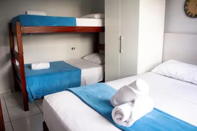 Uma cama ou camas num quarto em Maika'i Pousada