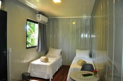 Uma cama ou camas num quarto em Innbox - Porto Belo