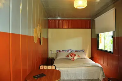 Uma cama ou camas num quarto em Innbox - Porto Belo