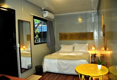 Uma cama ou camas num quarto em Innbox - Porto Belo