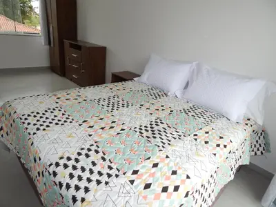 Uma cama ou camas num quarto em Residencial Farol das Conchas