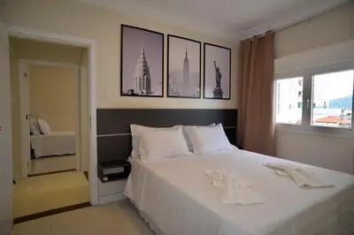 Uma cama ou camas num quarto em FRENTE MAR PÉ NA AREIA, na Av Atlântica