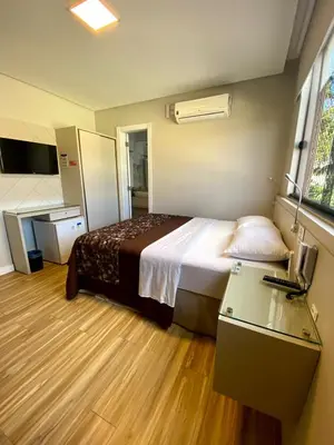 Uma cama ou camas num quarto em Pousada Bella Casa