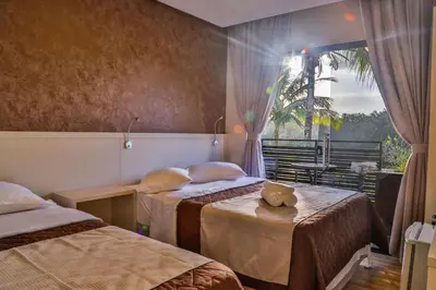 Uma cama ou camas num quarto em Pousada Bella Casa