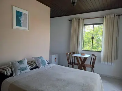 Uma cama ou camas num quarto em Recanto das Acacias