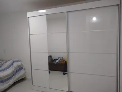 Uma cama ou camas num quarto em Apartamento Praia de Palmas