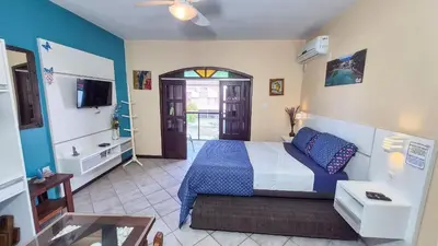 Uma cama ou camas num quarto em Casa de Hóspedes Canto dos Pássaros
