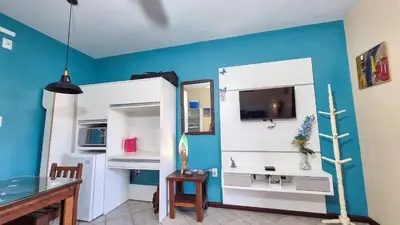 Uma televisão e/ou sistema de entretenimento em Casa de Hóspedes Canto dos Pássaros