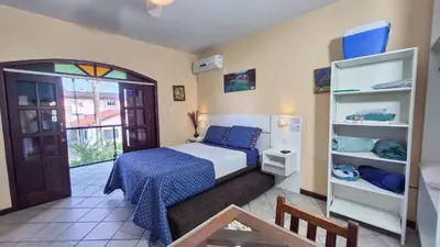 Uma cama ou camas num quarto em Casa de Hóspedes Canto dos Pássaros