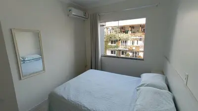 Uma cama ou camas num quarto em Res Nossa Sra dos Navegantes