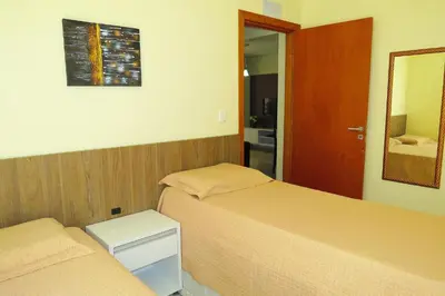 Uma cama ou camas num quarto em Res Praia do Sol