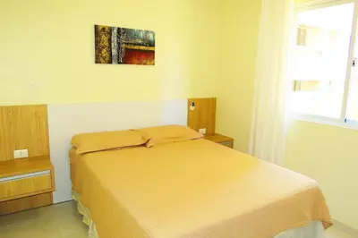Uma cama ou camas num quarto em Res Praia do Sol