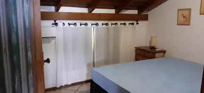 Uma cama ou camas num quarto em Um refúgio à Beira mar